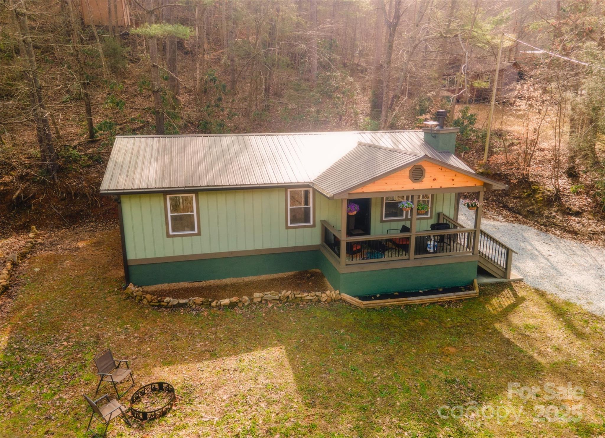 23 Honeysuckle Ridge Almond, NC 28702 - Photo 6 of 21 a front view of a house with garden