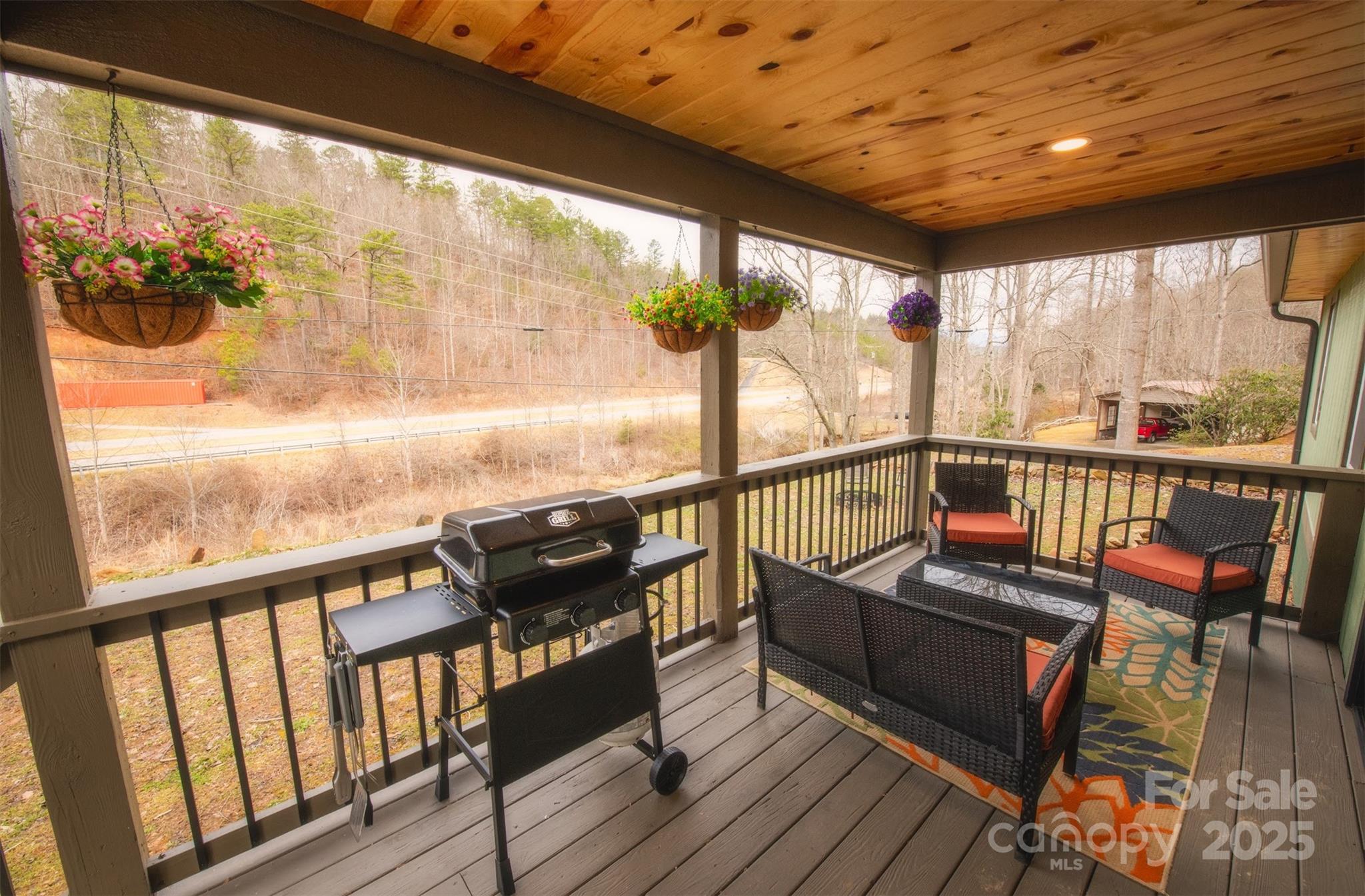 23 Honeysuckle Ridge Almond, NC 28702 - Photo 8 of 21 a view of a balcony with chairs