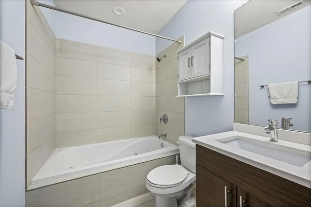 a bedroom with a workspace