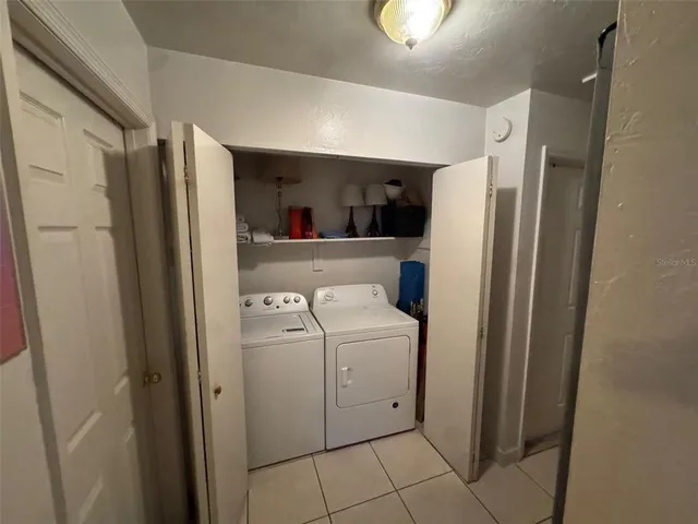 a view of bathroom with washer and dryer