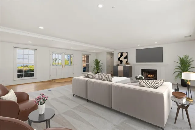 a bedroom with a bed couch and window