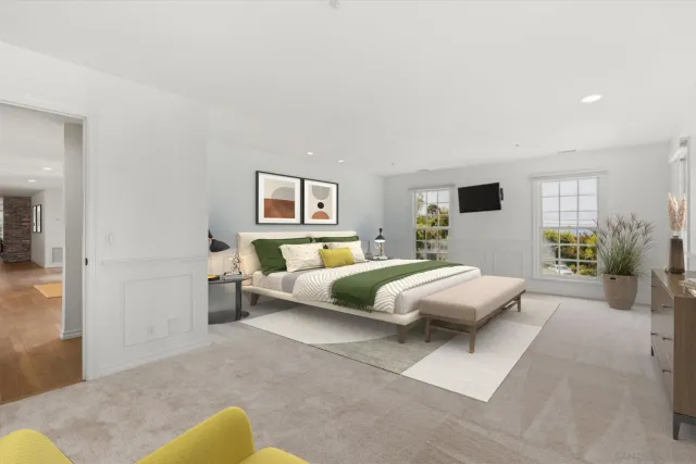 a bedroom with a large bed and a window