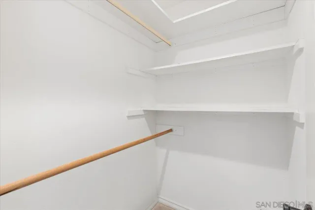 a bathroom with a sink a mirror and a shower