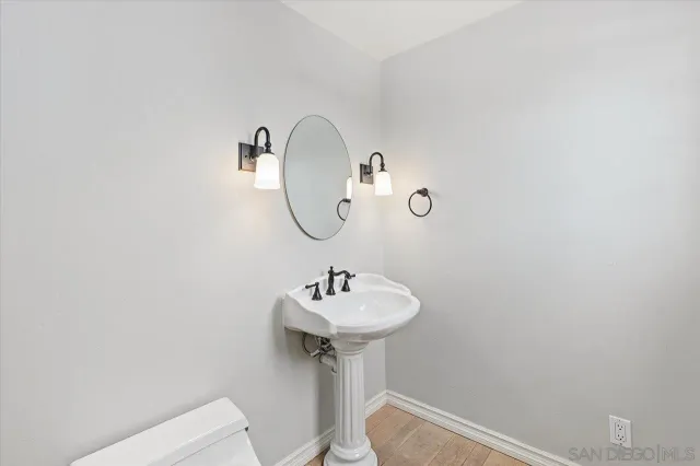 a large bathroom with a large tub sink vanity and windows