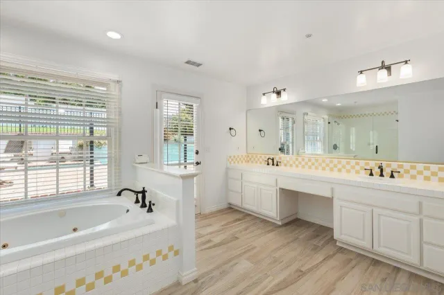 a view of a patio with table and chairs and potted plants