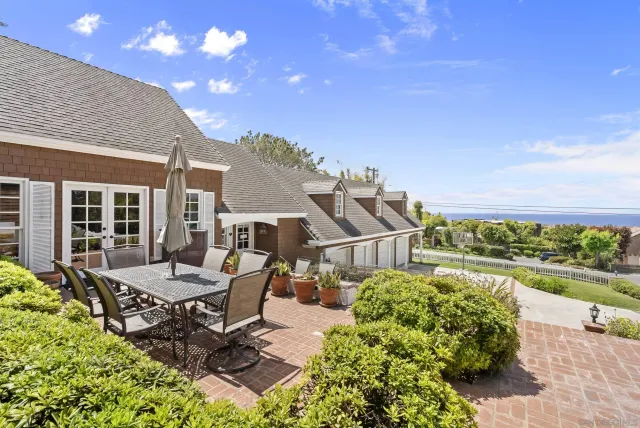 a view of a backyard with sitting area