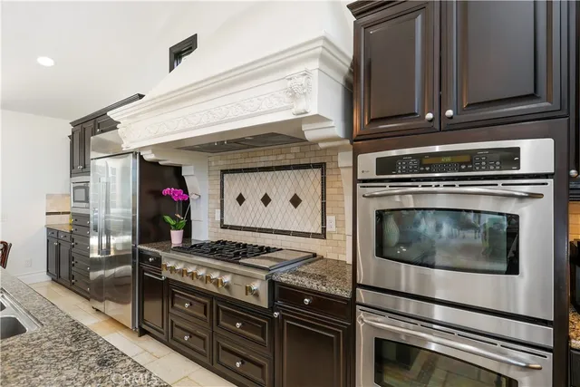 a view of an entryway with wooden floor and a livingroom