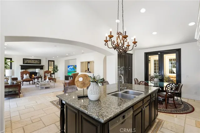 a living room with furniture a rug and a fireplace