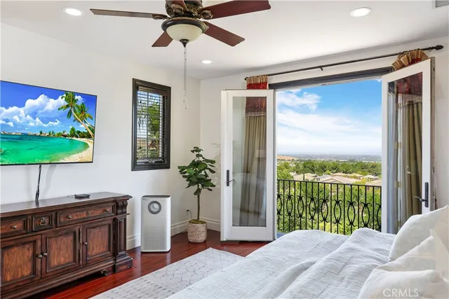 a spacious bathroom with a sink a large mirror and a shower