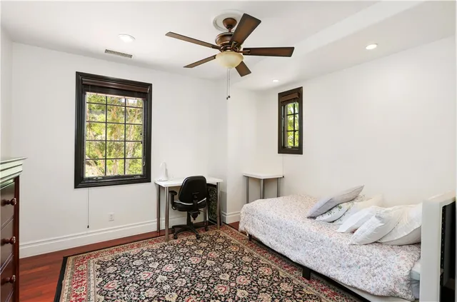 a view of a patio with table and chairs potted plants