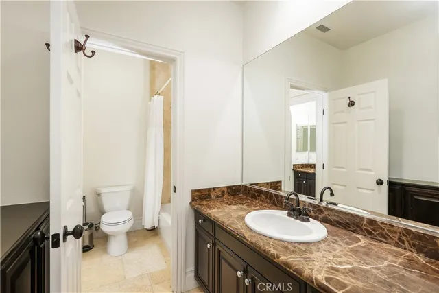 a house view with a sitting space fire pit and outdoor seating