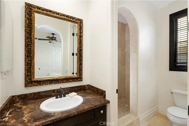 a view of a patio with table and chairs and potted plants