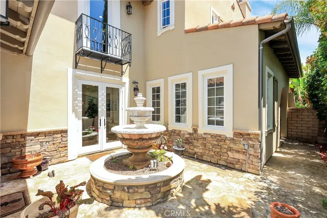 a view of a wooden chairs and table in the terrace