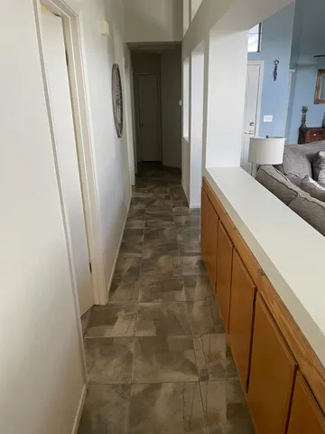 a view of a hallway with a door