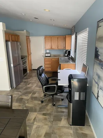 a work room with furniture and a window