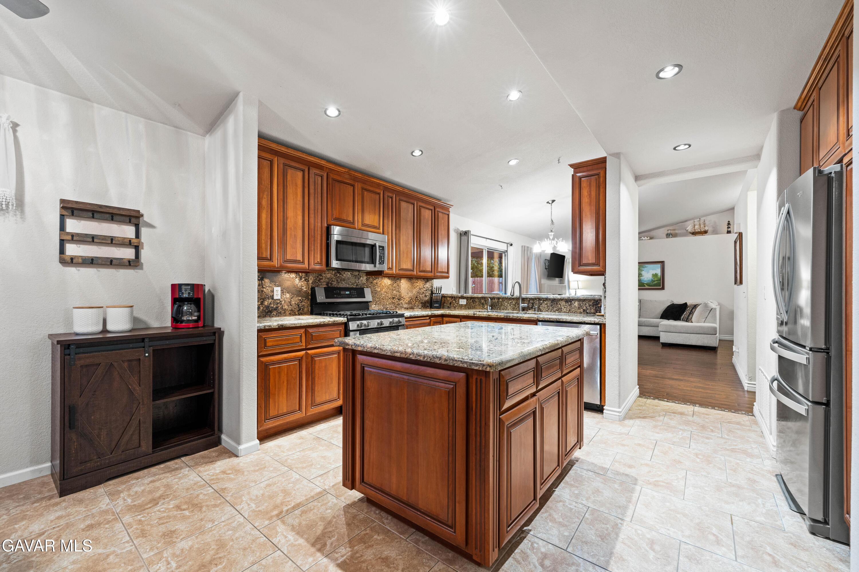 3418 Rodney Street Rosamond, CA 93560 - Photo 12 of 35 a kitchen with a sink stove and refrigerator