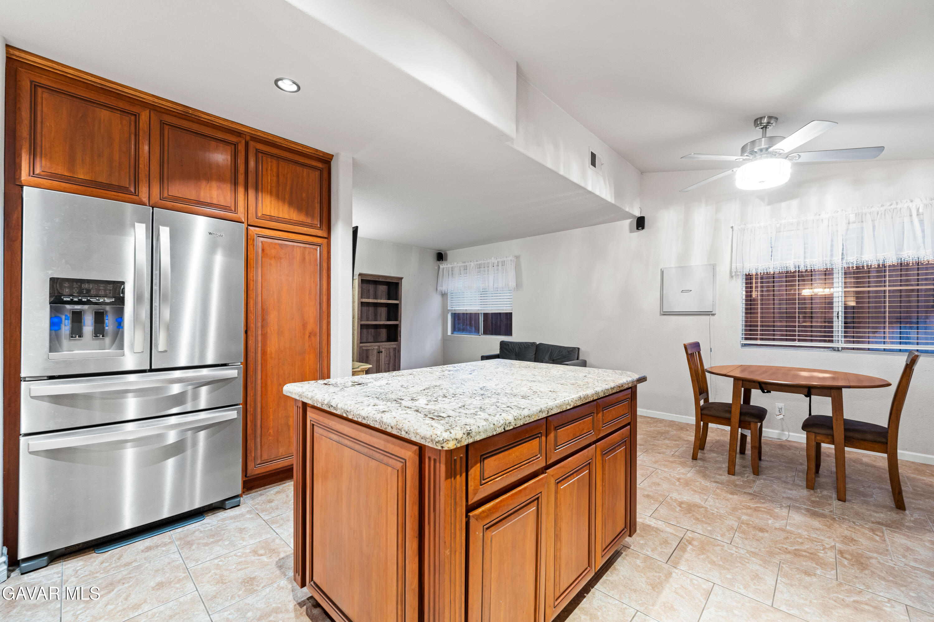 3418 Rodney Street Rosamond, CA 93560 - Photo 14 of 35 a kitchen with stainless steel appliances granite countertop a stove and refrigerator