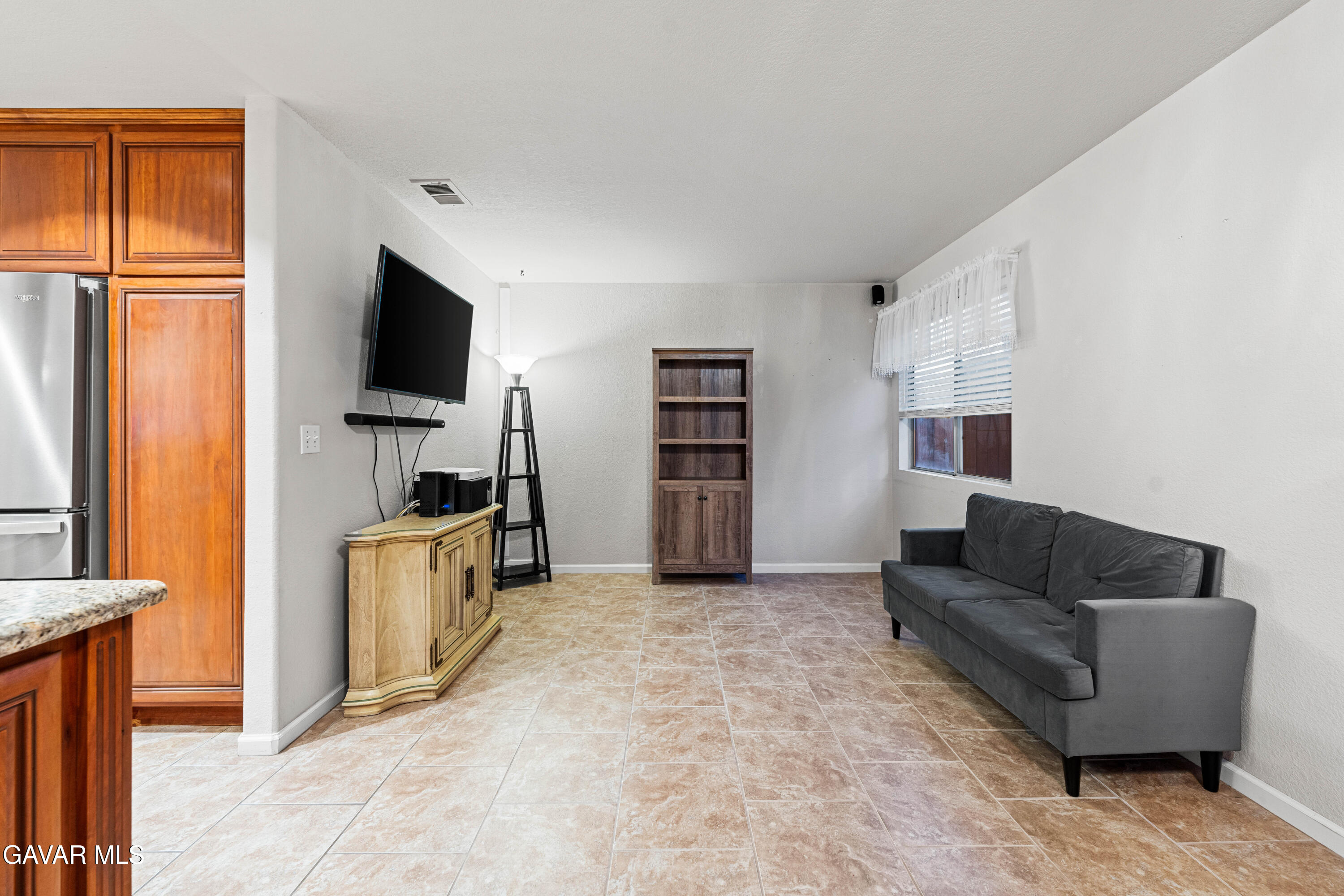 3418 Rodney Street Rosamond, CA 93560 - Photo 16 of 35 a living room with furniture and a flat screen tv