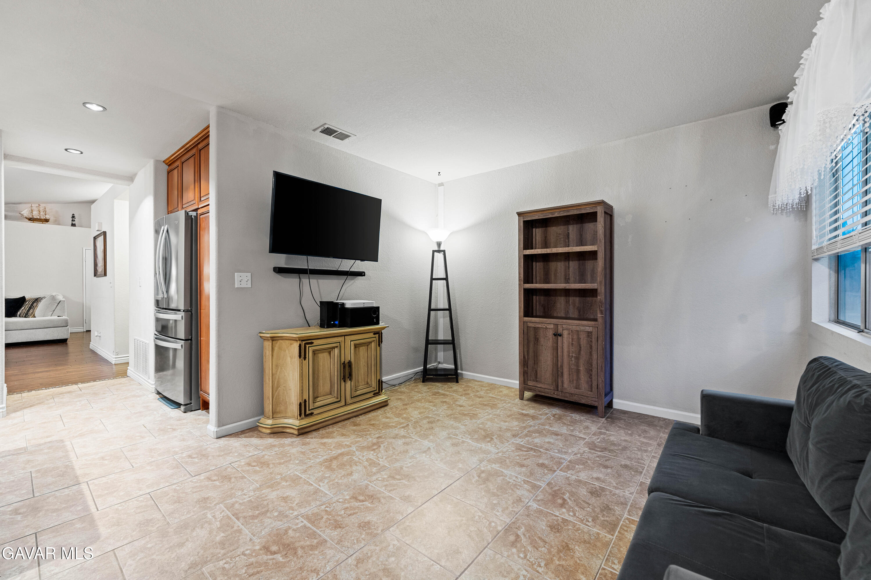 3418 Rodney Street Rosamond, CA 93560 - Photo 17 of 35 a view of a livingroom with furniture and a flat screen tv