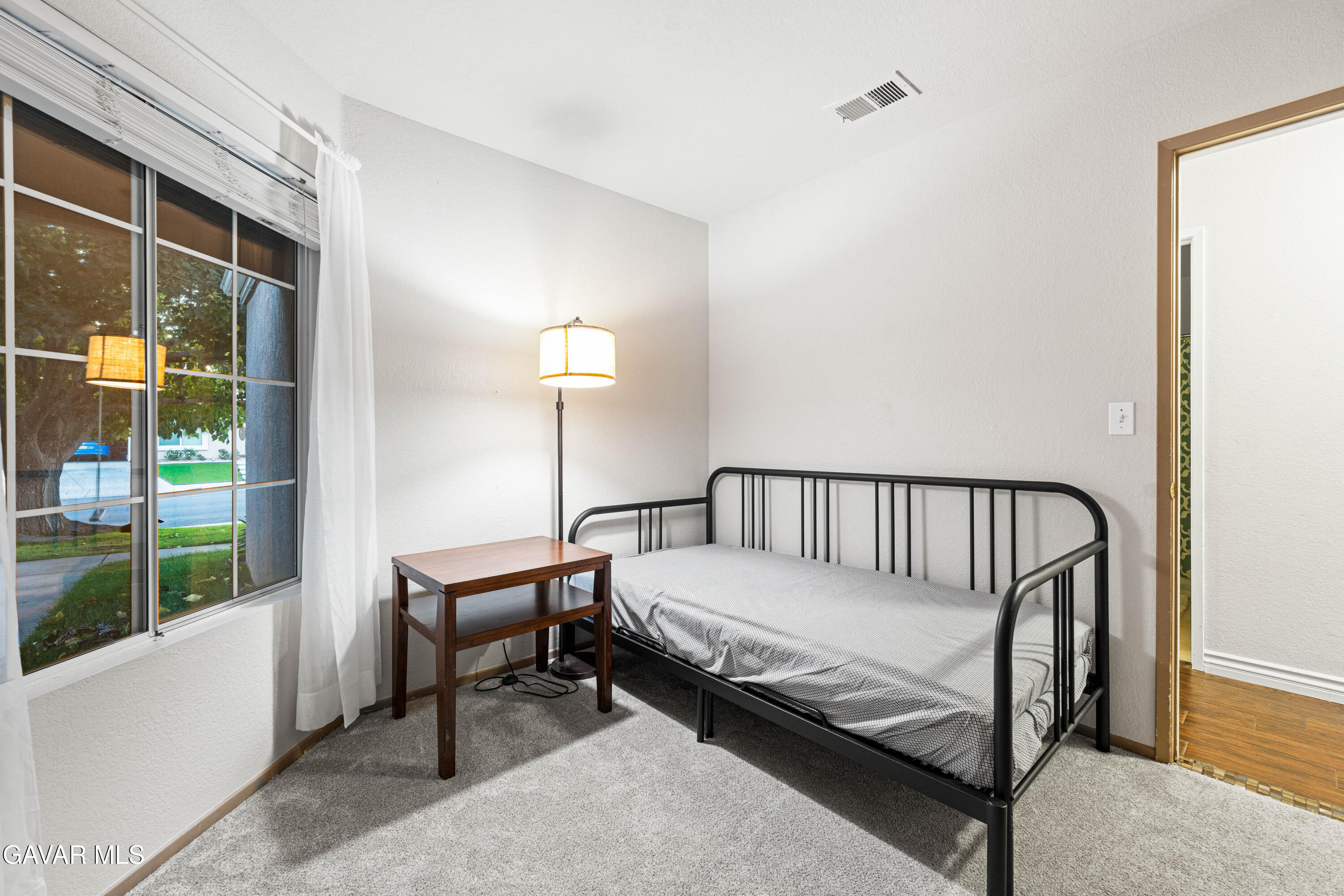 3418 Rodney Street Rosamond, CA 93560 - Photo 20 of 35 a bedroom with a bed and a window