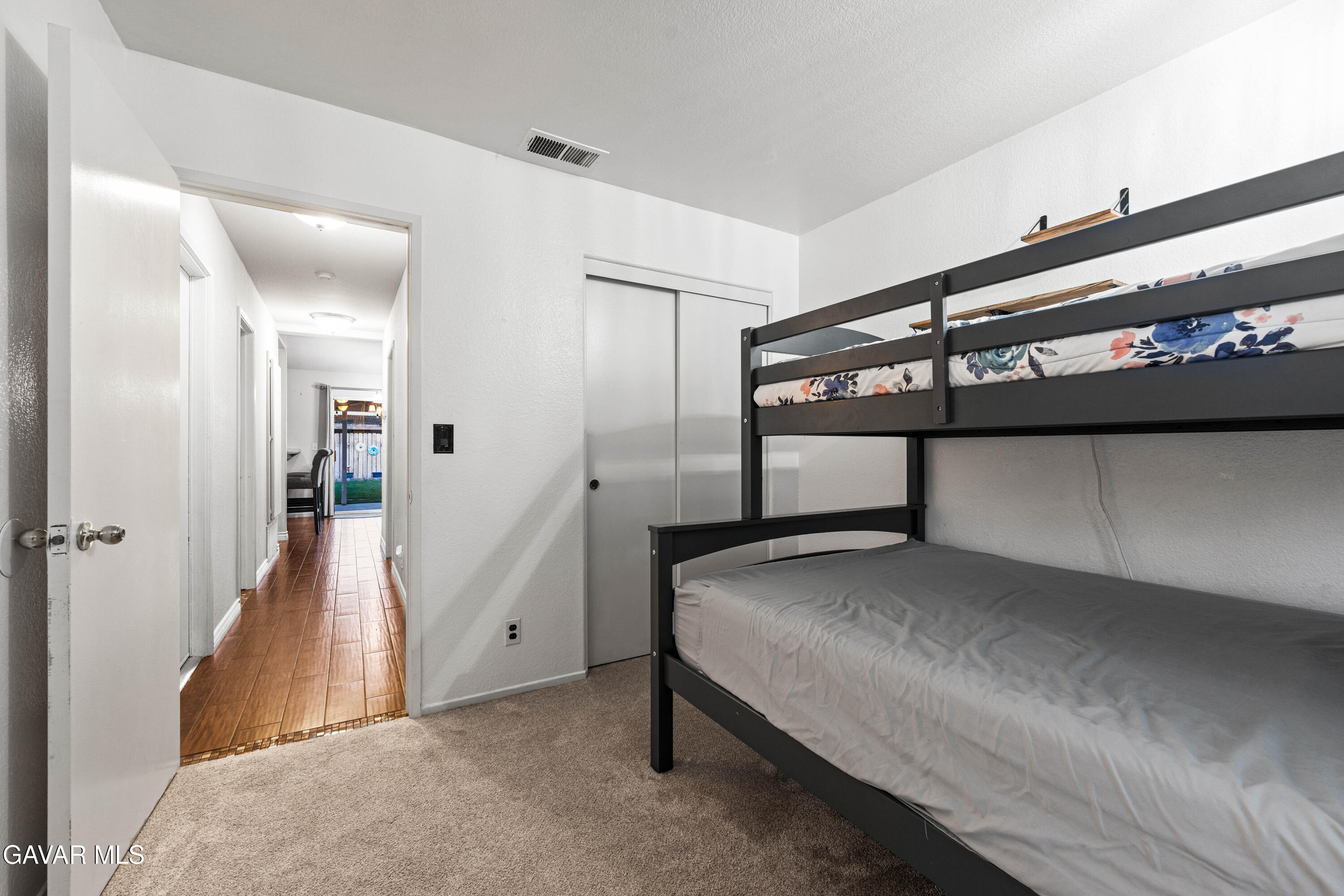 3418 Rodney Street Rosamond, CA 93560 - Photo 22 of 35 a bedroom with a bed and cabinet