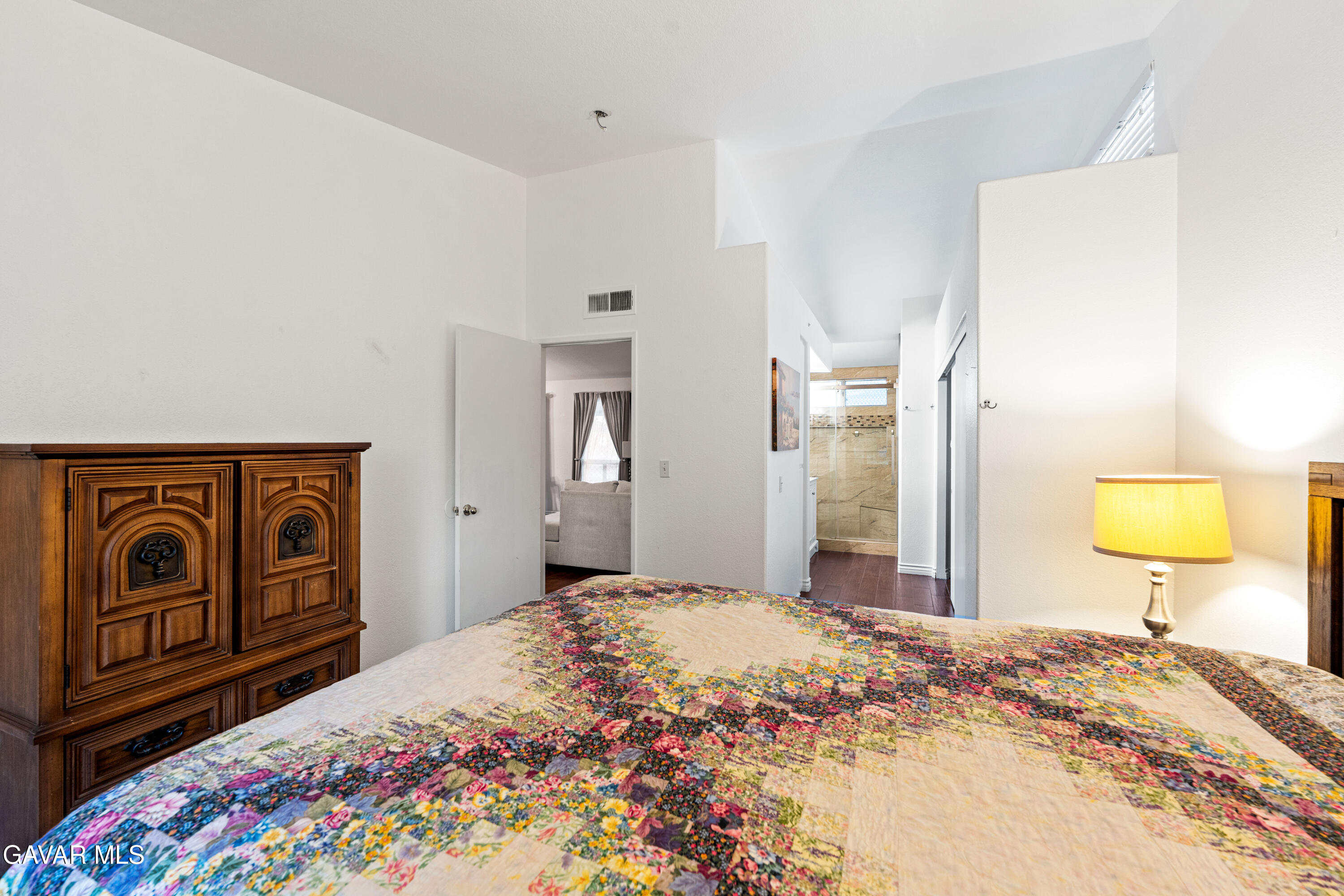 3418 Rodney Street Rosamond, CA 93560 - Photo 25 of 35 a bedroom with a bed and a dresser in it