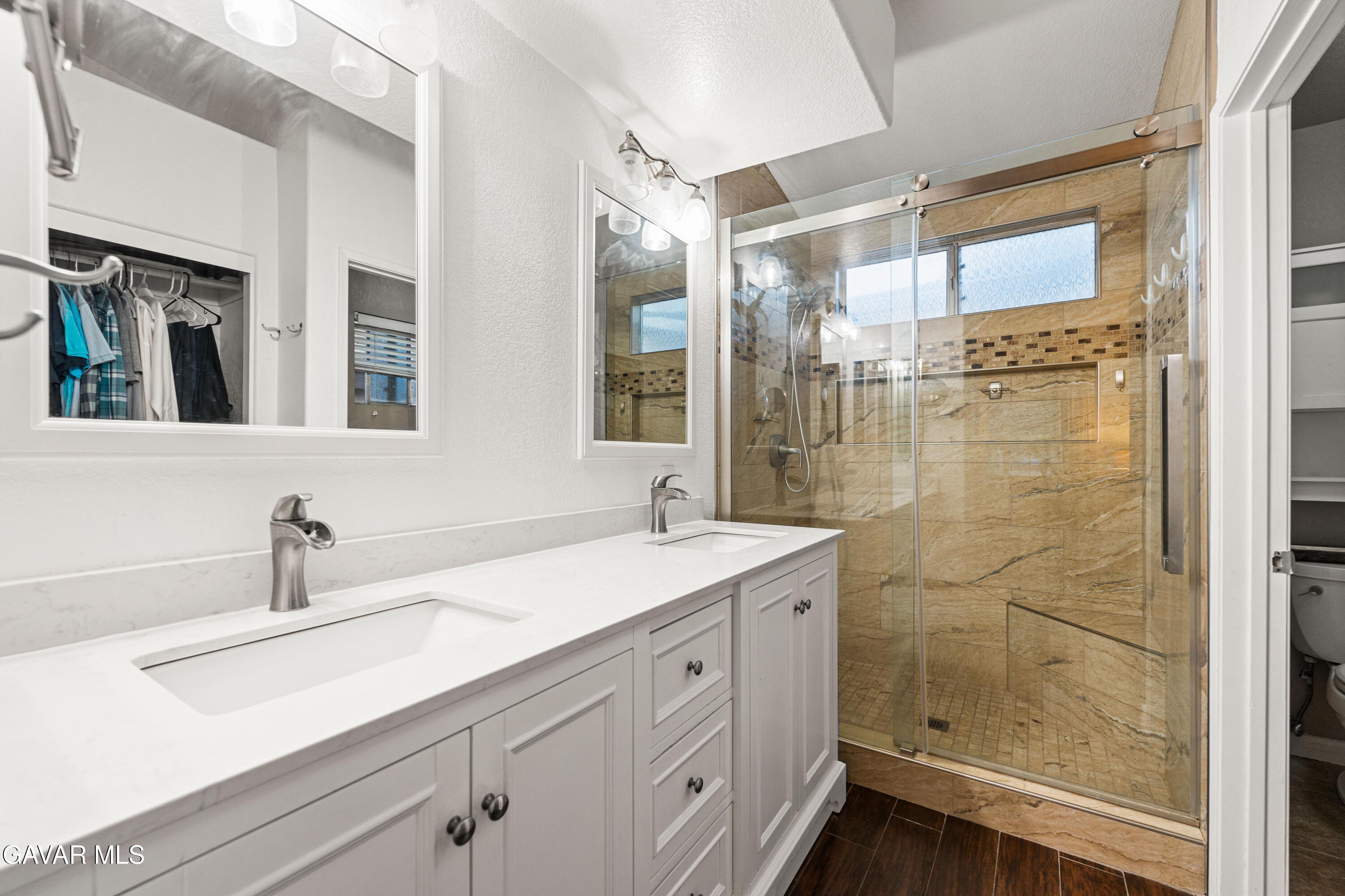 3418 Rodney Street Rosamond, CA 93560 - Photo 27 of 35 a bathroom with a sink and a mirror