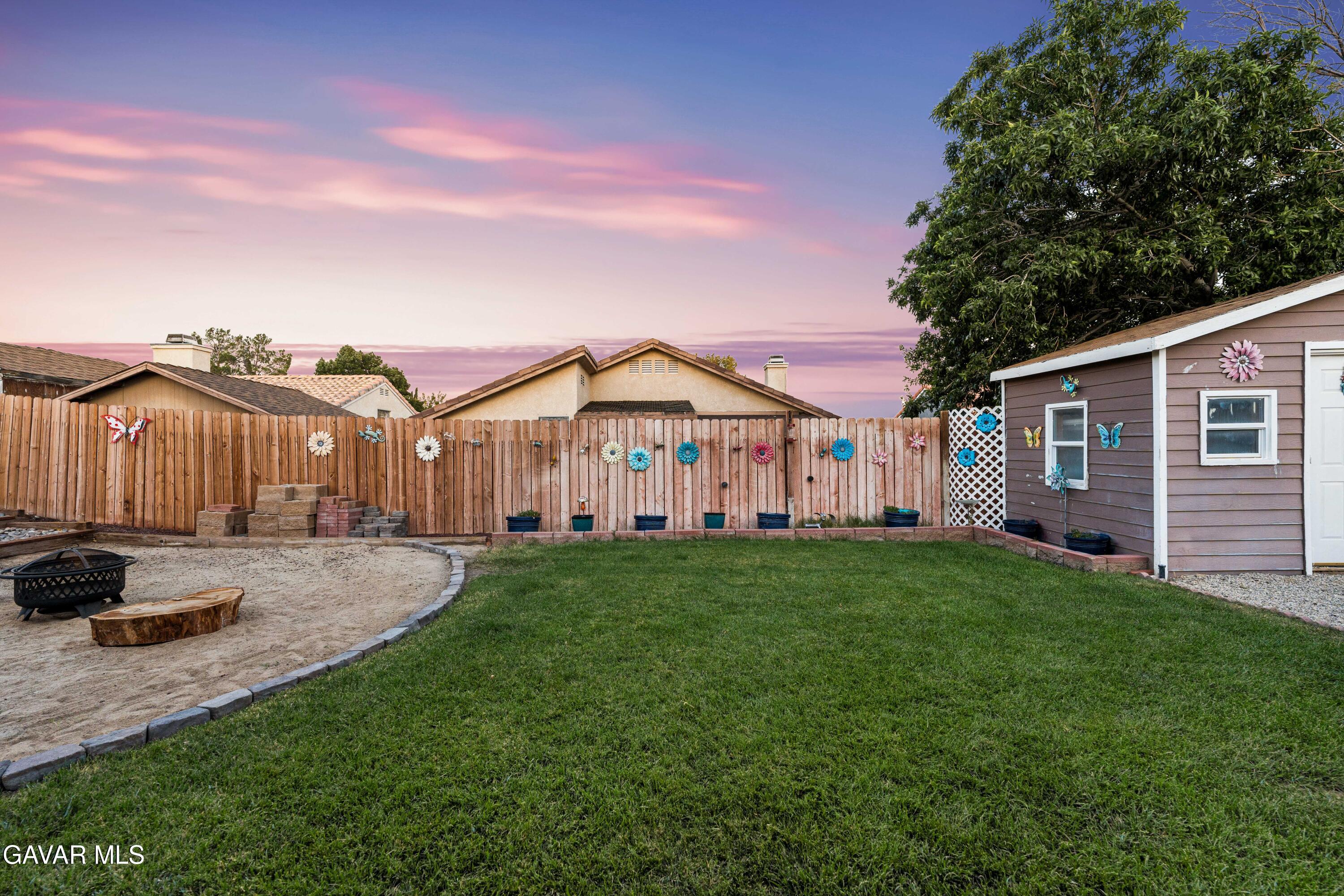 3418 Rodney Street Rosamond, CA 93560 - Photo 30 of 35 a view of a house with backyard and garden