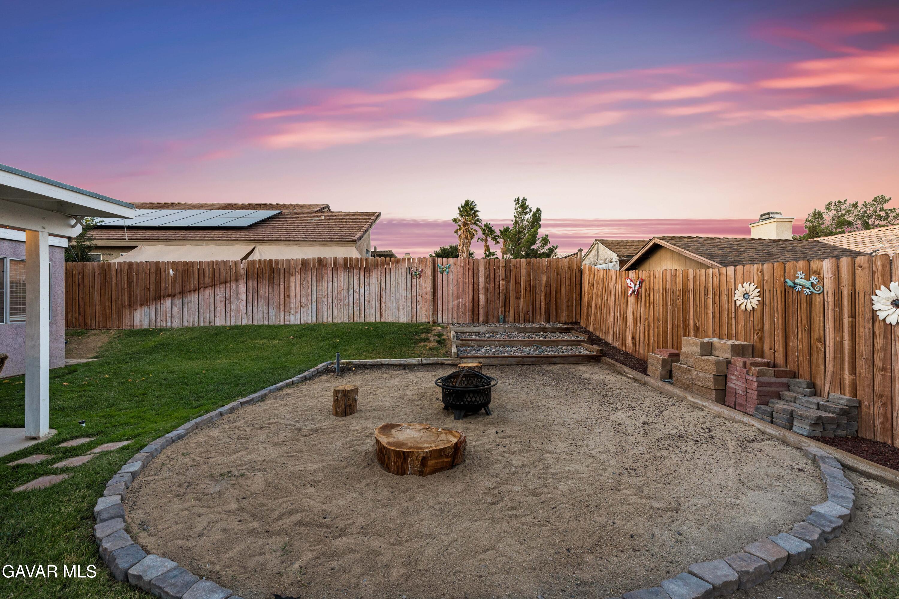 3418 Rodney Street Rosamond, CA 93560 - Photo 33 of 35 a view of a backyard with wooden fence