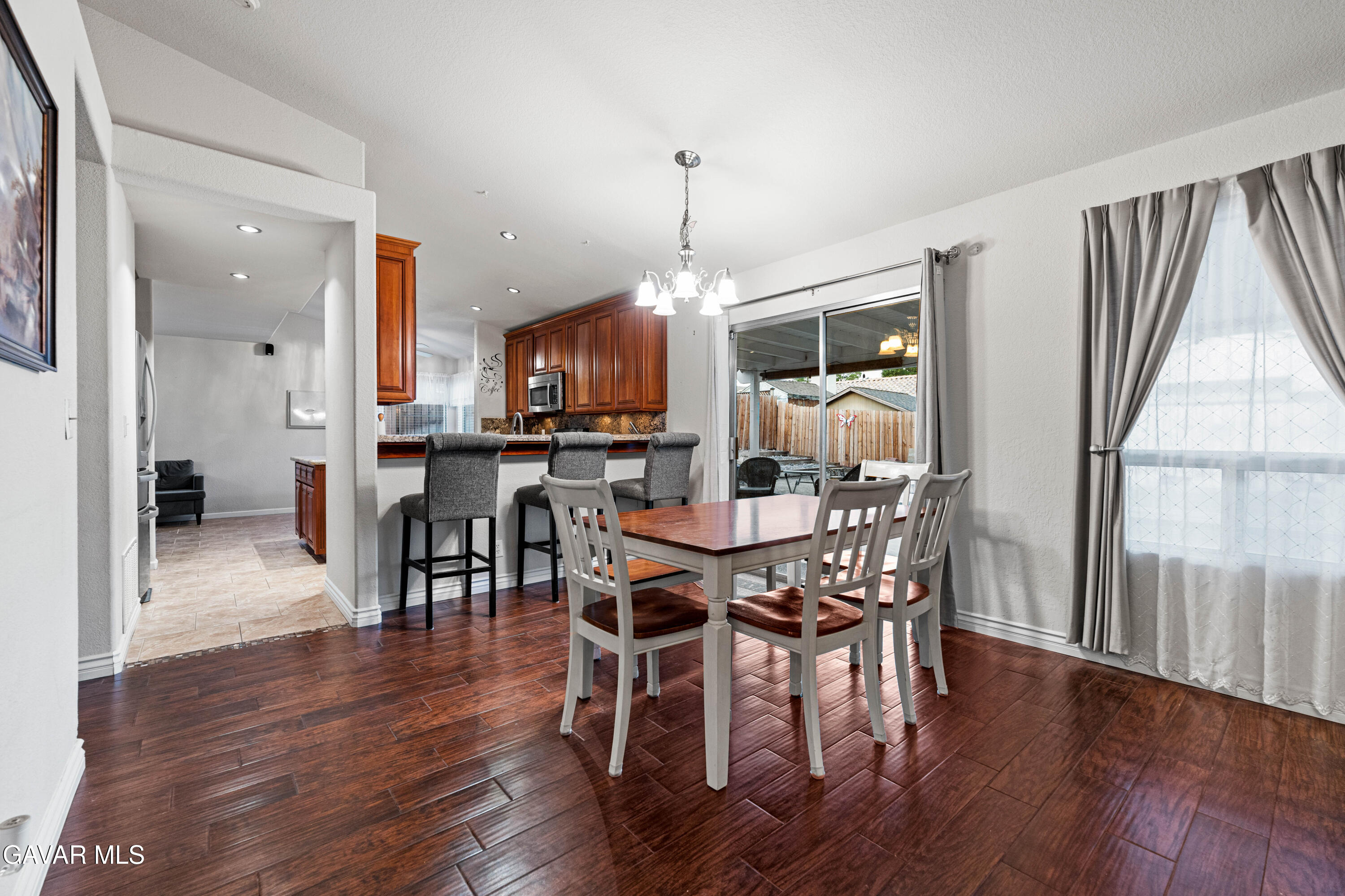 3418 Rodney Street Rosamond, CA 93560 - Photo 7 of 35 a view of a dining room with furniture window and wooden floor