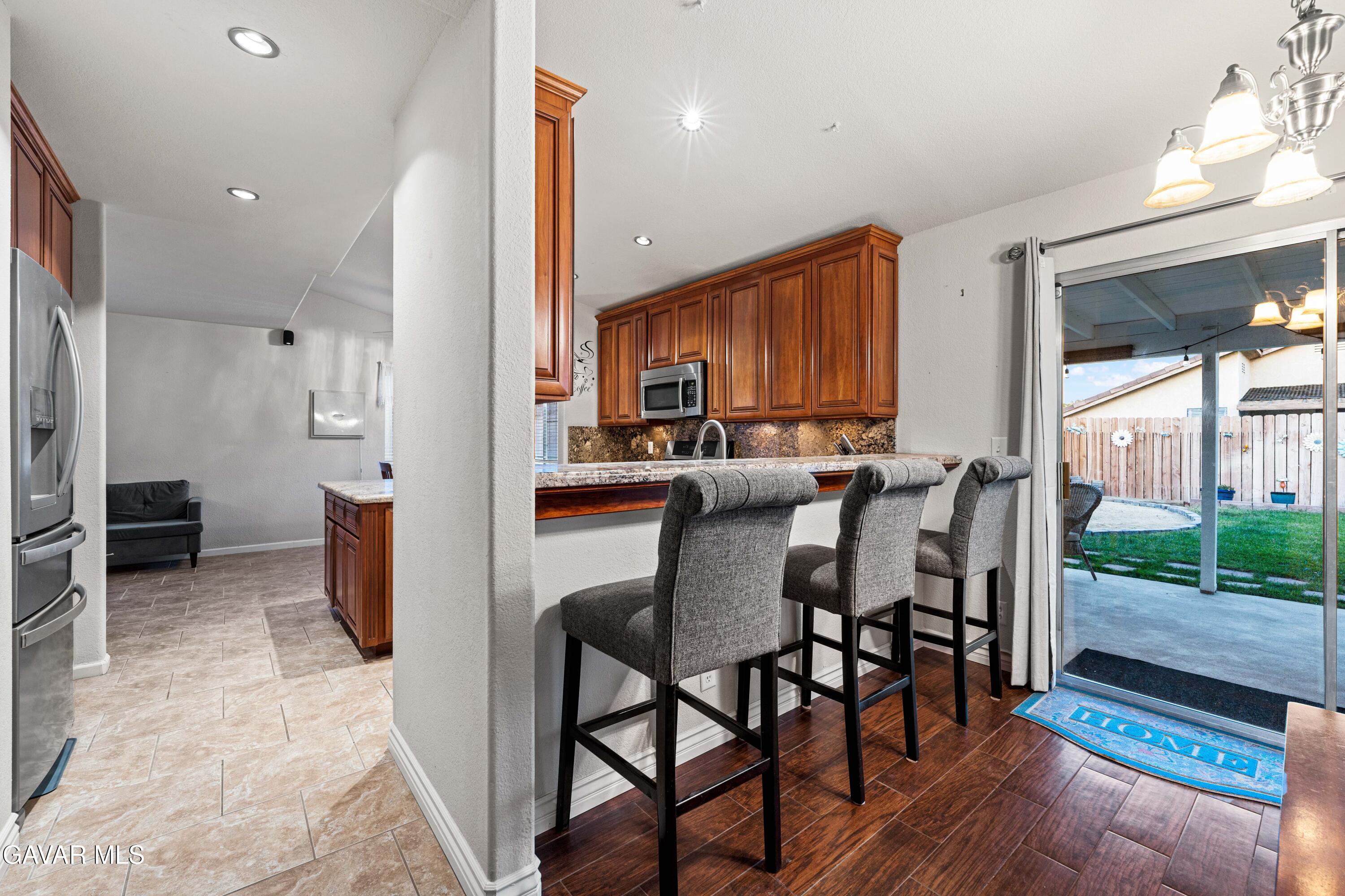 3418 Rodney Street Rosamond, CA 93560 - Photo 9 of 35 a kitchen with a table and chairs in it