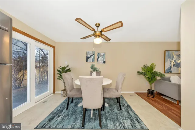 a spacious bedroom with a bed and a chandelier