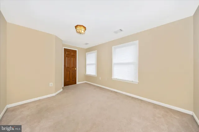 a view of a house with potted plants