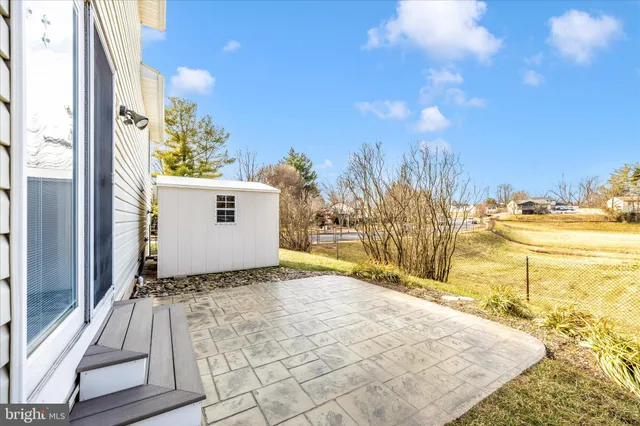 a view of a backyard of the house