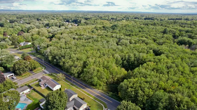 a view of a yard with an outdoor seating