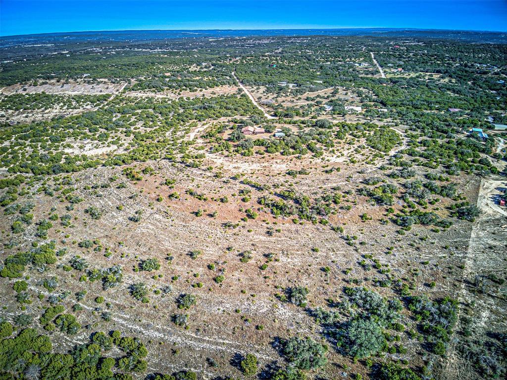 414 Hall Lane Spicewood, TX 78669 - Photo 6 of 16 a view of a city with lush green forest