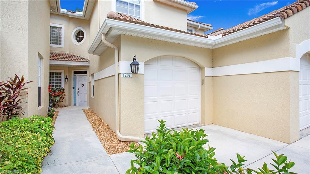 96 Silver Oaks Circle, Unit 1202 Naples, FL 34119 - Photo 2 of 30 a view of a pathway of a house