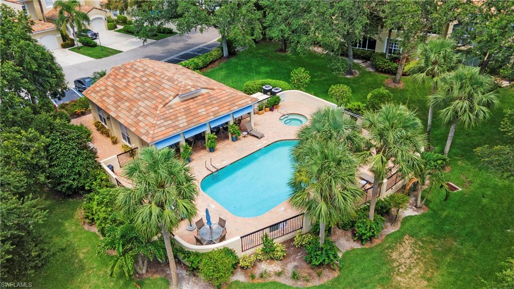 96 Silver Oaks Circle, Unit 1202 Naples, FL 34119 - Photo 21 of 30 an aerial view of a house with a garden