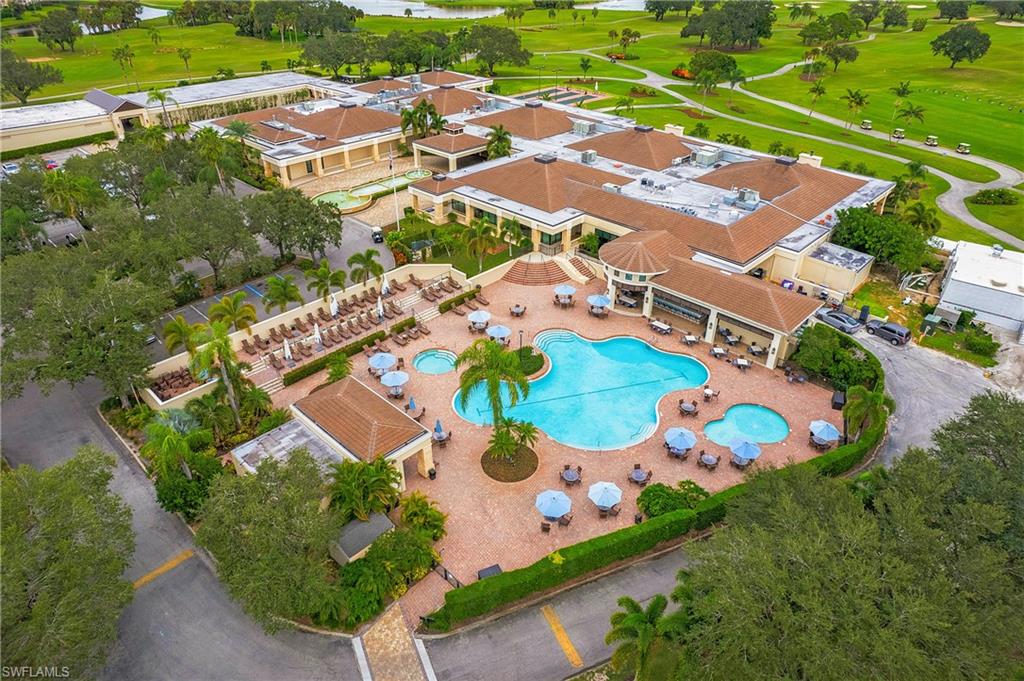 96 Silver Oaks Circle, Unit 1202 Naples, FL 34119 - Photo 22 of 30 an aerial view of residential house with outdoor space and pool