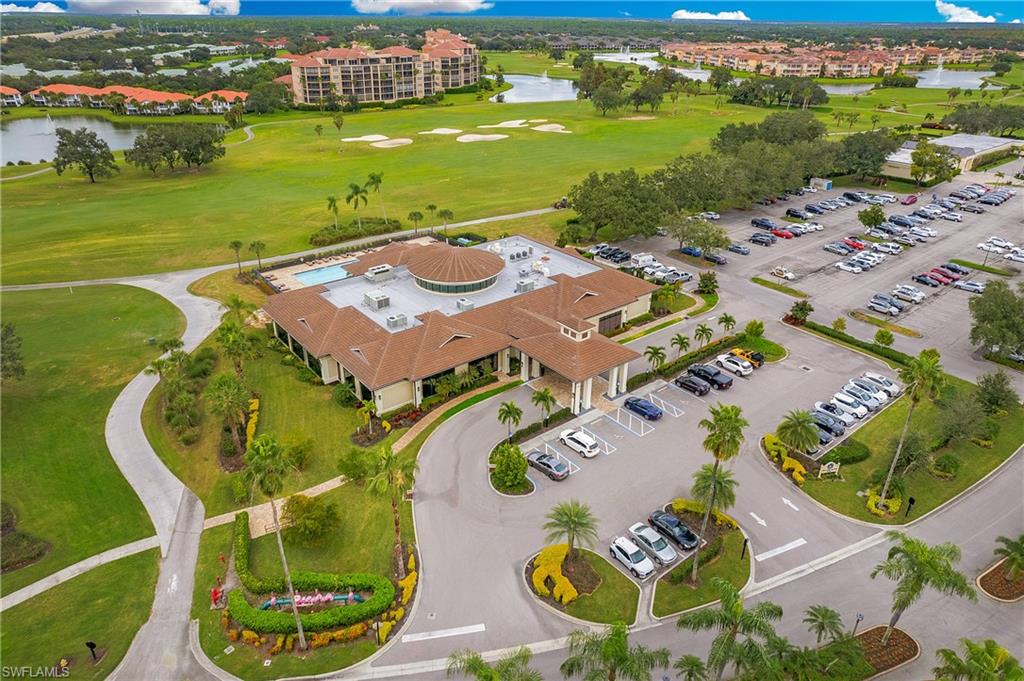 96 Silver Oaks Circle, Unit 1202 Naples, FL 34119 - Photo 23 of 30 an aerial view of a pool patio patio and outdoor kitchen