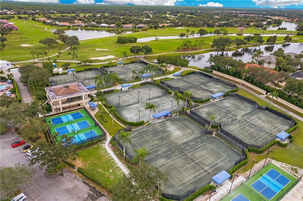 96 Silver Oaks Circle, Unit 1202 Naples, FL 34119 - Photo 24 of 30 an aerial view of residential houses with outdoor space