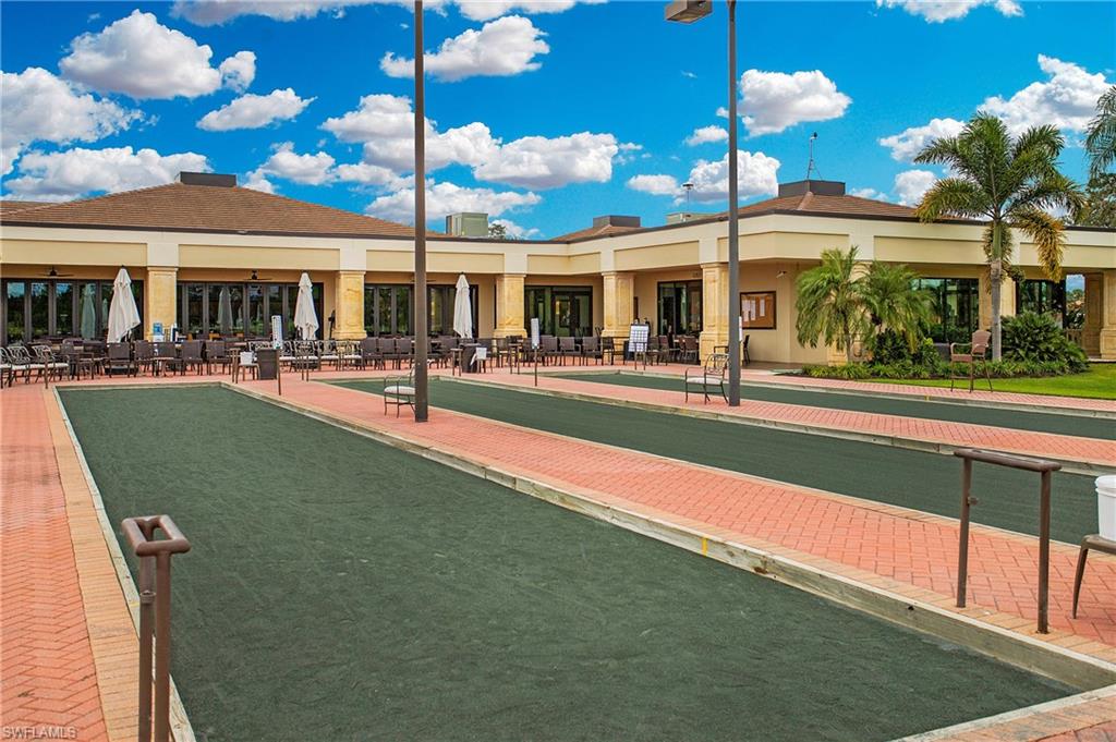 96 Silver Oaks Circle, Unit 1202 Naples, FL 34119 - Photo 27 of 30 a view of a building with a swimming pool
