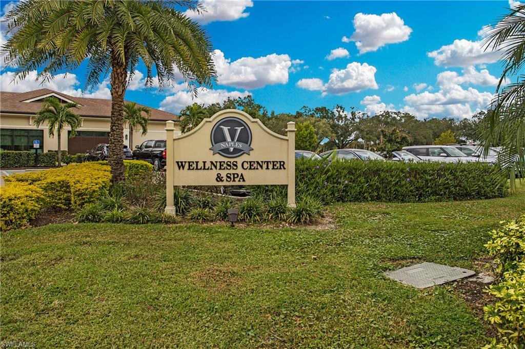96 Silver Oaks Circle, Unit 1202 Naples, FL 34119 - Photo 28 of 30 a view of a street with sign board
