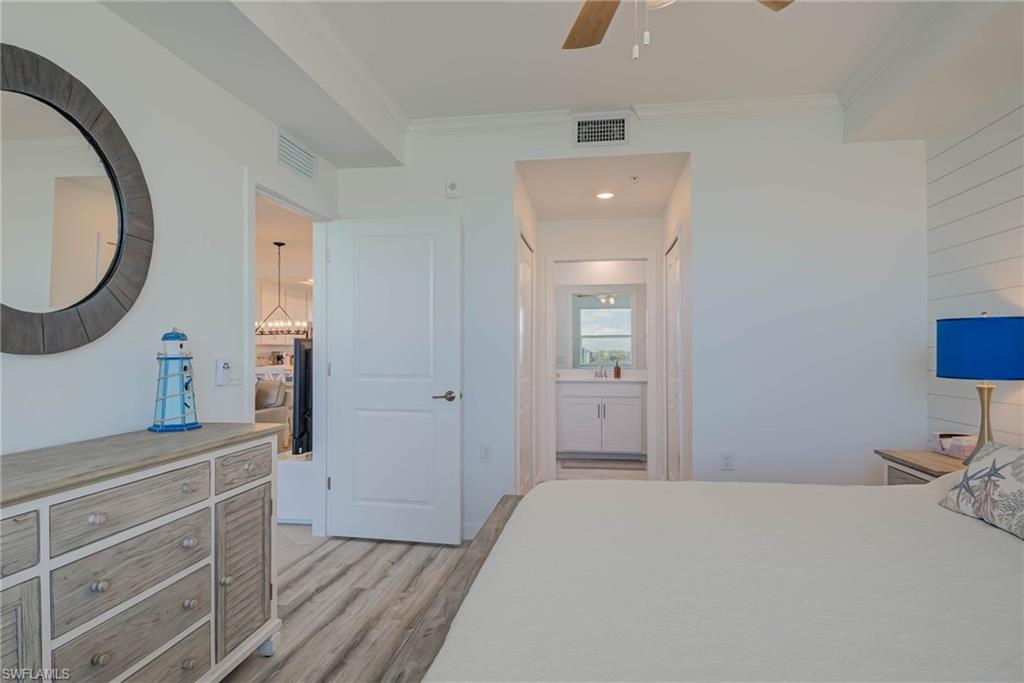 5807 Double Eagle Cir Avenue, Unit 4635 Immokalee, FL 34142 - Photo 15 of 43 a bedroom with a bed and a dresser