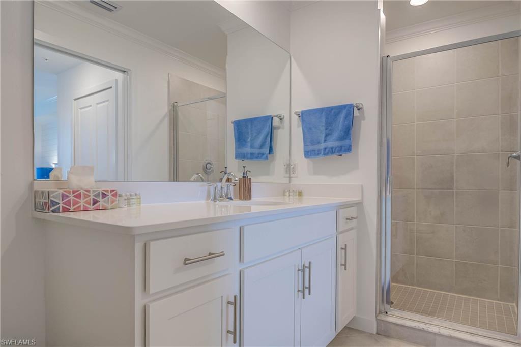 5807 Double Eagle Cir Avenue, Unit 4635 Immokalee, FL 34142 - Photo 16 of 43 a bathroom with a sink and a mirror