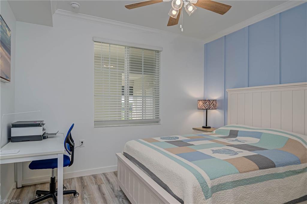 5807 Double Eagle Cir Avenue, Unit 4635 Immokalee, FL 34142 - Photo 17 of 43 a bedroom with a bed a desk and chair