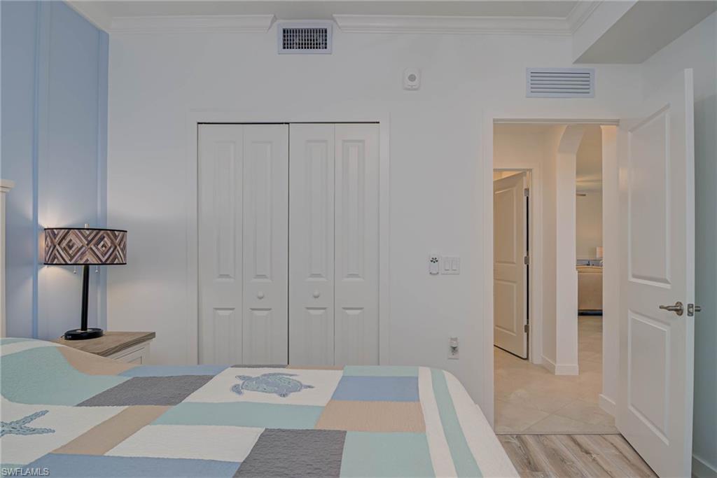 5807 Double Eagle Cir Avenue, Unit 4635 Immokalee, FL 34142 - Photo 18 of 43 a view of a hallway with wooden floor