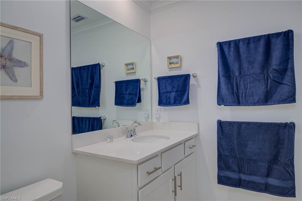 5807 Double Eagle Cir Avenue, Unit 4635 Immokalee, FL 34142 - Photo 20 of 43 a bathroom with a sink and a toilet