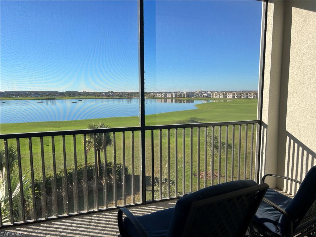 5807 Double Eagle Cir Avenue, Unit 4635 Immokalee, FL 34142 - Photo 2 of 43 a view of a balcony with chair and wooden floor