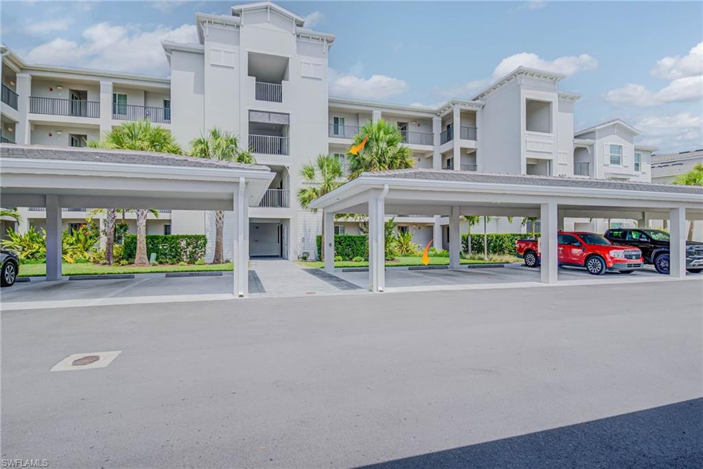 5807 Double Eagle Cir Avenue, Unit 4635 Immokalee, FL 34142 - Photo 29 of 43 a front view of building with an entrance and seating space
